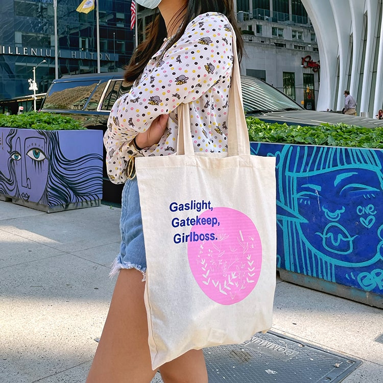 Canvas tote bags with pink botanical illustration with gaslight, gatekeep, girlboss phrase